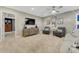 A comfortable bonus room featuring a sofa and two chairs, perfect for relaxation and entertaining at 6470 Amur Ct, Castle Rock, CO 80108