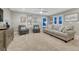 A comfortable bonus room featuring a sofa and two chairs, perfect for relaxation and entertaining at 6470 Amur Ct, Castle Rock, CO 80108