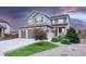 Charming two-story home boasts a well-manicured lawn, mature trees, and a welcoming front porch at 6470 Amur Ct, Castle Rock, CO 80108