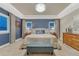 Serene main bedroom with tray ceiling, plush carpet, large windows, and elegant decor at 6470 Amur Ct, Castle Rock, CO 80108