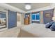 Comfortable main bedroom features tray ceiling, ensuite bath access, and large window at 6470 Amur Ct, Castle Rock, CO 80108