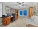 Home office featuring a large desk, bookshelves, and a comfortable chair at 6470 Amur Ct, Castle Rock, CO 80108