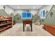 Fun playroom with a foosball table, toys and a playful painted mural at 6470 Amur Ct, Castle Rock, CO 80108