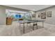 Spacious recreation room with game tables and playful painted mural at 6470 Amur Ct, Castle Rock, CO 80108