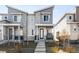 Stylish two-story townhome featuring stone accents and a covered front porch with space to relax at 47 N Uriah St, Aurora, CO 80018