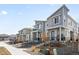 Modern townhome community featuring stylish exteriors, sidewalks, and well-maintained landscaping at 47 N Uriah St, Aurora, CO 80018