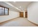 Finished basement featuring neutral carpet and a window for natural light at 115 S Jasmine St, Denver, CO 80224