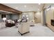 Spacious carpeted basement with a comfortable seating area and modern lighting at 115 S Jasmine St, Denver, CO 80224