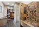 Luxurious bathroom with walk-in shower, custom cabinetry, and modern tile flooring at 115 S Jasmine St, Denver, CO 80224