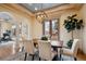 Open dining room with modern light fixture, neutral color palette, and natural light at 115 S Jasmine St, Denver, CO 80224