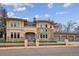 Stunning two-story home with stone accents, a gated yard, and a three-car garage at 115 S Jasmine St, Denver, CO 80224