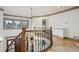 Elegant foyer with curved staircase, decorative lighting, and tiled flooring at 115 S Jasmine St, Denver, CO 80224