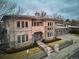 Stunning two-story home featuring stone accents, a manicured lawn, and a welcoming entrance with beautiful architectural details at 115 S Jasmine St, Denver, CO 80224
