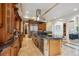 Gourmet kitchen featuring granite countertops, custom cabinets, stainless steel appliances, and a kitchen island at 115 S Jasmine St, Denver, CO 80224