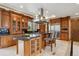 Spacious kitchen with custom cabinetry, a large center island, and top-of-the-line stainless steel appliances at 115 S Jasmine St, Denver, CO 80224