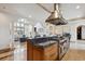 Open kitchen features granite countertops, a large island, and seamless flow into the living room at 115 S Jasmine St, Denver, CO 80224