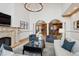 Bright living room with fireplace, chandelier, and seamless flow into a modern kitchen at 115 S Jasmine St, Denver, CO 80224