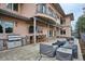 Backyard patio featuring an outdoor kitchen with seating, a built-in grill, and ample space for entertaining at 115 S Jasmine St, Denver, CO 80224