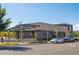 Contemporary retail building with outdoor seating, offering a unique dining experience with ample parking at 115 S Jasmine St, Denver, CO 80224