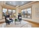 Cozy sitting area featuring large windows with natural light and hardwood flooring at 115 S Jasmine St, Denver, CO 80224