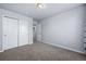 This bedroom has neutral walls, carpeted floors, and a closet with bi-fold doors at 39283 Hart Cir, Elizabeth, CO 80107