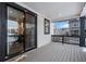 Covered patio with string lights, wood decking, and sliding glass doors to the home's interior at 39283 Hart Cir, Elizabeth, CO 80107