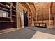 Unfinished attic storage area with shelving at 601 Cheyenne St # 202, Golden, CO 80403