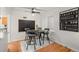 Cozy dining area with a round table, modern chairs, and a blackboard wall at 1218 S University Blvd, Denver, CO 80210