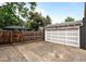 Exterior view of detached one-car garage with a private driveway and fencing at 1218 S University Blvd, Denver, CO 80210