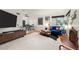 Bright and airy living room featuring hardwood floors, a modern ceiling fan, and stylish furnishings at 1218 S University Blvd, Denver, CO 80210
