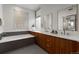 Serene bathroom with dual sinks, a soaking tub, and modern finishes for ultimate relaxation at 3233 Tejon St # 305, Denver, CO 80211