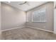 This cozy bedroom is carpeted and features a modern ceiling fan and two large windows for lots of natural light at 3233 Tejon St # 305, Denver, CO 80211