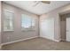 This cozy bedroom is carpeted and features a modern ceiling fan and two large windows for lots of natural light at 3233 Tejon St # 305, Denver, CO 80211