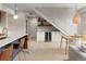 Open concept dining area featuring a staircase, modern lighting, and a wine fridge at 3233 Tejon St # 305, Denver, CO 80211