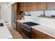Close up of the modern kitchen design featuring stainless steel appliances, stylish tile, and wood cabinets at 3233 Tejon St # 305, Denver, CO 80211