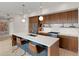 Contemporary kitchen with seating at the island, modern appliances, and sleek cabinets at 3233 Tejon St # 305, Denver, CO 80211