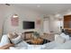 Comfortable living room featuring a cozy sofa, stylish decor, and a modern entertainment center at 3233 Tejon St # 305, Denver, CO 80211
