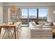 Relaxing living room with comfortable seating, bright light and a view to the outside patio at 3233 Tejon St # 305, Denver, CO 80211