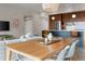 Inviting living room with an open floor plan connecting the kitchen, dining area, and a comfortable sofa at 3233 Tejon St # 305, Denver, CO 80211