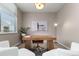 Calm and stylish home office setup with a wooden desk, modern lighting, and comfortable seating at 3233 Tejon St # 305, Denver, CO 80211