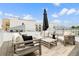 Relaxing rooftop deck featuring stylish outdoor furniture, city views, and a cozy ambiance at 3233 Tejon St # 305, Denver, CO 80211