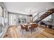 Bright dining room featuring a contemporary table, chairs, and modern staircase design at 3615 Lipan St, Denver, CO 80211