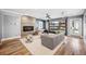 Inviting living room with a fireplace, stylish seating, and a glass garage door opening to the outside at 3615 Lipan St, Denver, CO 80211