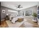 This main bedroom boasts natural light from windows and hardwood flooring at 3615 Lipan St, Denver, CO 80211