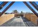 Outdoor patio with a gray brick floor, bamboo railing and a metal fire pit to enjoy the outdoors at 3615 Lipan St, Denver, CO 80211