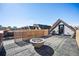 Relax on this rooftop deck with modern fire pit and city skyline views at 3615 Lipan St, Denver, CO 80211