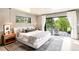 Bright bedroom featuring patio access and large windows for ample natural light and views at 18910 Augusta Dr, Monument, CO 80132