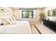 Bright bedroom with a large window, comfortable bed, stylish decor, and ample natural light at 18910 Augusta Dr, Monument, CO 80132