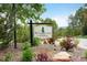 Attractive community sign for The Country Club at Woodmoor, surrounded by landscaped foliage at 18910 Augusta Dr, Monument, CO 80132