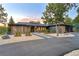 Stunning modern home with unique wood siding, gravel landscaping, and a paved driveway at 18910 Augusta Dr, Monument, CO 80132